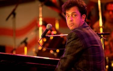 Musician Billy Joel performs onstage during the first Farm Aid benefit concert at Memorial Stadium, Champaign, Illinois, September 22, 1985. (Photo by Paul Natkin/Getty Images)