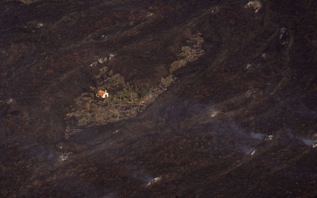 Lava from a volcano eruption flows on the island of La Palma in the Canaries, on September 23, 2021. - A volcano on a small Spanish island in the Atlantic Ocean erupted forcing the evacuation of thousands of people. (Photo by EMILIO MORENATTI / POOL / AFP) (Photo by EMILIO MORENATTI/POOL/AFP via Getty Images)