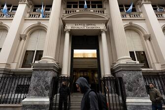 BUENOS AIRES, ARGENTINA - JULY 04: A man walks by Argentina's central bank on July 04, 2022 in Buenos Aires, Argentina. In the midst of a political crisis and economic uncertainty, President Fernandez appointed Silvina Batakis on Sunday to replace Martin Guzman, who was negotiating the payment of Argentina's 44 billion dollars debt. (Photo by Tomas Cuesta/Getty Images)