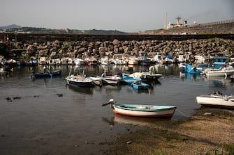 POZZUOLI, ITALY - OCTOBER 23: The general view of Darsena dei Pescatori, an inlet used as a port for small boats where the rising of the ground and the shallows caused by bradyseism are visible on October 23, 2023 in Pozzuoli, Italy. The Campi Flegrei, a large dormant volcano near Naples, has a history of eruptions, with the last one in 1538. Recently, increased seismic activity and rising land levels have raised concerns among local residents. Experts from the National Institute of Geology and Volcanology (INGV) say these are typical signs of the volcano being active, but they're keeping a close watch because this area has a history of big eruptions. (Photo by Ivan Romano/Getty Images)