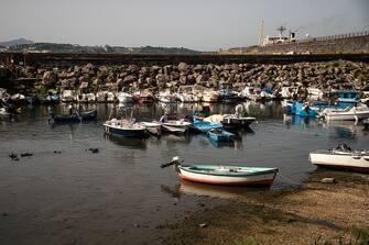 POZZUOLI, ITALY - OCTOBER 23: The general view of Darsena dei Pescatori, an inlet used as a port for small boats where the rising of the ground and the shallows caused by bradyseism are visible on October 23, 2023 in Pozzuoli, Italy. The Campi Flegrei, a large dormant volcano near Naples, has a history of eruptions, with the last one in 1538. Recently, increased seismic activity and rising land levels have raised concerns among local residents. Experts from the National Institute of Geology and Volcanology (INGV) say these are typical signs of the volcano being active, but they're keeping a close watch because this area has a history of big eruptions. (Photo by Ivan Romano/Getty Images)