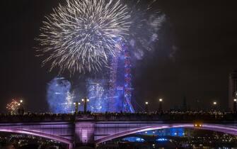 LONDON, UNITED KINGDOM - JANUARY 1: Fireworks light up the London sky over the London Eye to celebrate the new year in United Kingdom on January 1, 2023. (Photo by Rasid Necati Aslim/Anadolu Agency via Getty Images)