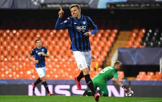 epa08284691 A handout image provided by UEFA shows Josip Ilicic of Atalanta celebrating a goal during the UEFA Champions League round of 16 second leg match between Valencia CF and Atalanta BC at Estadio Mestalla in Valencia, Spain, 10 March 2020. The match takes place behind closed doors due to the coronavirus (COVID-19) outbreak.  EPA/UEFA / HO **SHUTTERSTOCK OUT** HANDOUT NO SALES/NO ARCHIVES
