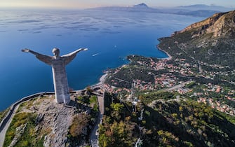 Aerial view of the statue of the Redeemer or Christ the Redeemer overlooking the Lucanian city of Maratea.Potenza province, Basilicata, Italy