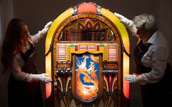 A general view of A multicoloured, illuminated 1941 Wurlitzer jukebox, which was acquired by Mercury for his kitchen at Garden Lodge, a
room where he spent so much of his time. (est. £15,000 - £25,000) as part of a photocall for Sotheby's 'Freddie Mercury A World Of His Own' Exhibition which runs for four weeks and contains more than 1,400 lots from his London home - Sotheby's in London, England, UK on Thursday 3 August, 2023.
 
*** lyrics are copyright: Queen Music Ltd/Sony Music Publishing UK Ltd ***, Credit:Justin Ng / Avalon