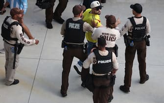 MIAMI GARDENS, FLORIDA - JULY 14: Police detain a fan of Colombia prior to the CONMEBOL Copa America 2024 Final match between Argentina and Colombia at Hard Rock Stadium on July 14, 2024 in Miami Gardens, Florida. (Photo by Megan Briggs/Getty Images)