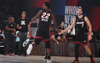 ORLANDO, FL - SEPTEMBER 8: Jimmy Butler #22 high-fives Goran Dragic #7 of the Miami Heat during Game Five of the Eastern Conference SemiFinals of the NBA Playoffs on September 8, 2020 at The Field House in Orlando, Florida. NOTE TO USER: User expressly acknowledges and agrees that, by downloading and/or using this Photograph, user is consenting to the terms and conditions of the Getty Images License Agreement. Mandatory Copyright Notice: Copyright 2020 NBAE (Photo by Nathaniel S. Butler/NBAE via Getty Images)