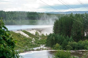 Water flows at the Braskereidfoss Power plant after floodgates did not work properly, on August 9, 2023. Authorities in Norway are considering blowing up a dam at risk of bursting after days of heavy rain. (Photo by Cornelius Poppe / NTB / AFP) / Norway OUT (Photo by CORNELIUS POPPE/NTB/AFP via Getty Images)