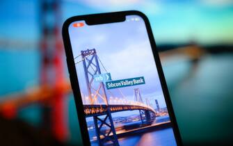 The Silicon Valley Bank (SVB) logo is seen on a phone screen in this photo illustration on 11 March, 2023 in Warsaw, Poland. (Photo by Jaap Arriens/NurPhoto)