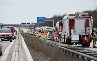 Emergency personnel is seen on the A9 highway, at the scene of an accident where at least five people were killed, on March 27, 2024 in Schkeuditz, near Leipzig, eastern Germany. (Photo by Jens Schlueter / AFP) (Photo by JENS SCHLUETER/AFP via Getty Images)