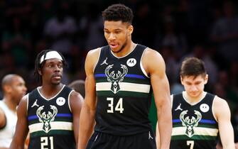 BOSTON, MASSACHUSETTS - MAY 15: (L-R) Jrue Holiday #21, Giannis Antetokounmpo #34 and Grayson Allen #7 of the Milwaukee Bucks react during the first half against the Boston Celtics in Game Seven of the 2022 NBA Playoffs Eastern Conference Semifinals at TD Garden on May 15, 2022 in Boston, Massachusetts. NOTE TO USER: User expressly acknowledges and agrees that, by downloading and/or using this photograph, User is consenting to the terms and conditions of the Getty Images License Agreement. (Photo by Adam Glanzman/Getty Images)