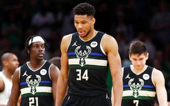 BOSTON, MASSACHUSETTS - MAY 15: (L-R) Jrue Holiday #21, Giannis Antetokounmpo #34 and Grayson Allen #7 of the Milwaukee Bucks react during the first half against the Boston Celtics in Game Seven of the 2022 NBA Playoffs Eastern Conference Semifinals at TD Garden on May 15, 2022 in Boston, Massachusetts. NOTE TO USER: User expressly acknowledges and agrees that, by downloading and/or using this photograph, User is consenting to the terms and conditions of the Getty Images License Agreement. (Photo by Adam Glanzman/Getty Images)