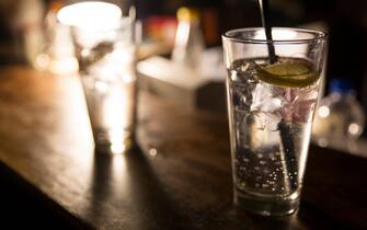 Vodka lemon with ice cubes on the bar