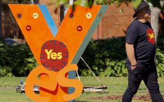 A person takes part in a "Walk for Yes" rally in Sydney on September 17, 2023. Thousands joined "Walk for Yes" events in major cities, ahead of the referendum that could grant Indigenous Australians a constitutionally enshrined right to be consulted on policies that affect them -- a "Voice to Parliament". (Photo by Andrew LEESON / AFP) (Photo by ANDREW LEESON/AFP via Getty Images)