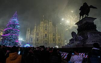 MILAN, ITALY - JANUARY 1: Fireworks go off around Piazza Duomo during new year celebrations in Milan, Italy on January 1, 2023. (Photo by Piero Cruciatti/Anadolu Agency via Getty Images)