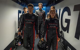 (l to r) Sang Heon Lee, Darren Barnet, Archie Madekwe, Emelia Hartford and Pepe Barroso Silva are GT Academy drivers in Columbia Pictures GRAN TURISMO. Photo by: Gordon Timpen