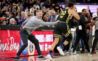 SAN FRANCISCO, CALIFORNIA - DECEMBER 19: Head coach Steve Kerr congratulates Stephen Curry #30 of the Golden State Warriors after he made a three-point basket over Derrick White #9 of the Boston Celtics at the end of overtime to clinch their victory at Chase Center on December 19, 2023 in San Francisco, California. NOTE TO USER: User expressly acknowledges and agrees that, by downloading and or using this photograph, User is consenting to the terms and conditions of the Getty Images License Agreement.  (Photo by Ezra Shaw/Getty Images)