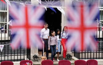 Prime Minister Rishi Sunak with dog Nova and wife, Akshata Murty, with children Krishna Sunak (left) and Anoushka Sunak before hosting a Coronation Big Lunch in Downing Street, London, for volunteers, Ukrainian refugees in the UK, and youth groups. Thousands of people across the country are celebrating the Coronation Big Lunch on Sunday to mark the crowning of King Charles III and Queen Camilla. Picture date: Sunday May 7, 2023.