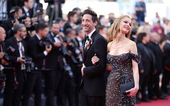 CANNES, FRANCE - MAY 23: Adrien Brody and Georgina Chapman attends the "Asteroid City" red carpet during the 76th annual Cannes film festival at Palais des Festivals on May 23, 2023 in Cannes, France. (Photo by Andreas Rentz/Getty Images)
