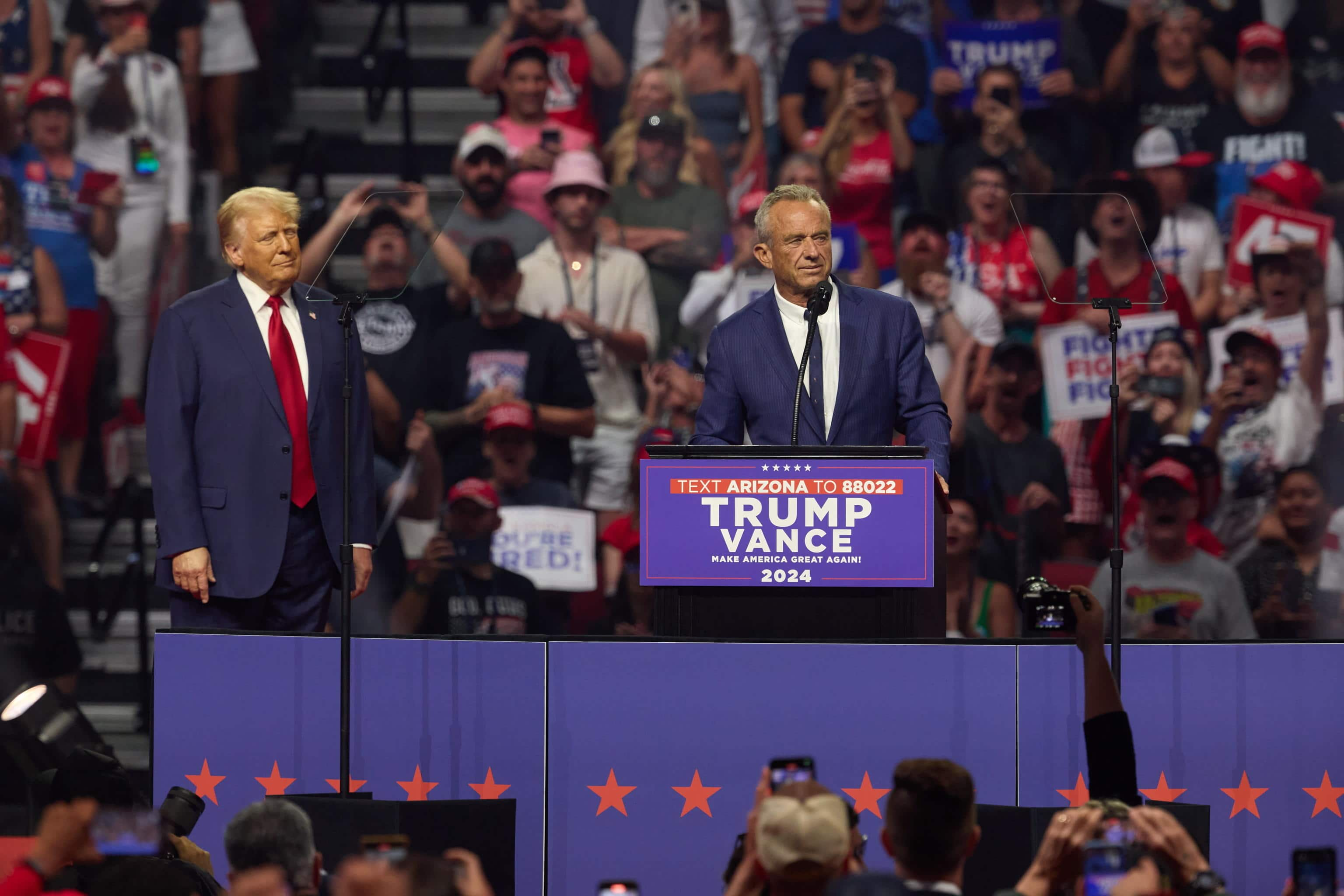 epa11562345 Robert F. Kennedy Jr. joins Republican presidential nominee Donald J. Trump (L) at an election rally at the Desert Diamond Arena in Glendale, Arizona, USA, 23 August 2024. The US presidential election takes place on 05 November 2024. Kennedy announced earlier today that he is ending his campaign for the presidency and endorsing Republican presidential nominee Donald Trump.  EPA/ALLISON DINNER