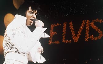FILE - This 1972 file photo shows Elvis Presley during a performance. The AP reported on July 14, 2017, that a story claiming a dead homeless man in San Diego was identified as Presley is a hoax. Presley died in 1977. (ANSA/AP Photo, File) [CopyrightNotice: Copyright 2017 The Associated Press. All rights reserved.]