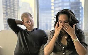 BGUK_2532905 - Los Angeles, CA  - Meghan Markle breaks down in tears in Netflix documentary as she discusses being trolled on social media and getting death threats. Both Meghan and Harry hit out at hateful social media and the credibility given to it by journalists who repeat the ‘hateful’ comments or write stories about it. Harry declared: “I think it’s unethical and an abuse of power.” But it’s Meghan who claims she’s been left scared by threatening Tweets and by stories printed in the papers. Megan wiped away tears as she said: “When you plant a seed that is so hateful, what it can grow into…I mean just a couple of days ago I was going through the manual for the security team at home and on one of the pages I happened to flip to it was about online monitoring. Like: ‘If you see a Tweet like this, please report it to head of security immediately’. And it said: ‘Meghan just needs to die. Someone needs to kill her, maybe it should be me’. And I like: ‘Ok, that’s what’s actually out in the world because of people creating hate’. And I’m a mom, that’s my real life. And then you see it and you go: ‘That’s making people want to kill me’. It’s not just a tabloid, it’s not just some story. You are making me scared. And then that night, I was up all night, looking up and down the hallway, saying: ‘Are we safe? Are the doors locked? Is the security on? That’s real. Are my babies safe? And you’ve created it for what? Because you’re bored? Or because it sells your papers? Or it makes you feel better about your own life? It’s real what you’re doing.” Later in the documentary she is shown crying again after she has a guided meditation session with Prince Harry. The voice of Prince Harry and Meghan's guided meditation instructor is heard telling the couple to inhale and exhale as they sit on a sofa with their palms facing up at the ceiling. She tells the couple: “Remember that what is transpiring in the media, what's being created, is an illusion. When you try to prove that you're good and that you're not the person they say you are, you're taking the bait, you're feeding the beast. It is an illusion. Your work is not to prove your goodness. You know who you are, both of you.” After being told that their session has come to an end, Meghan has tears streaming down her face. Meghan then wipes away the tears as her visibly emotional husband leans his head back on the sofa.  Harry then says: “As sad as it is, in order for change to happen, sometimes a lot of pain has to come to the surface.

Pictured: Meghan Markle, Prince Harry

BACKGRID UK 15 DECEMBER 2022 

BYLINE MUST READ: Netflix / BACKGRID

*BACKGRID DOES NOT CLAIM ANY COPYRIGHT OR LICENSE IN THE ATTACHED MATERIAL. ANY DOWNLOADING FEES CHARGED BY BACKGRID ARE FOR BACKGRID'S SERVICES ONLY, AND DO NOT, NOR ARE THEY INTENDED TO, CONVEY TO THE USER ANY COPYRIGHT OR LICENSE IN THE MATERIAL. BY PUBLISHING THIS MATERIAL , THE USER EXPRESSLY AGREES TO INDEMNIFY AND TO HOLD BACKGRID HARMLESS FROM ANY CLAIMS, DEMANDS, OR CAUSES OF ACTION ARISING OUT OF OR CONNECTED IN ANY WAY WITH USER'S PUBLICATION OF THE MATERIAL*

UK: +44 208 344 2007 / uksales@backgrid.com

USA: +1 310 798 9111 / usasales@backgrid.com

*UK Clients - Pictures Containing Children
Please Pixelate Face Prior To Publication*