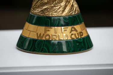 The FIFA World Cup trophy is displayed during an event in New York after an announcement related to the staging of the FIFA World Cup 2026, on June 16, 2022. - Mexico City's iconic Azteca Stadium and the Los Angeles Rams' multi-billion-dollar SoFi Stadium were among 16 venues named on June 16 to stage games at the 2026 World Cup being held in the United States, Canada and Mexico. (Photo by Yuki IWAMURA / AFP) (Photo by YUKI IWAMURA/AFP via Getty Images)