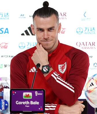DOHA, QATAR - NOVEMBER 24: Gareth Bale of Wales reacts  during the Wales Press Conference at the Main Media Center on November 24, 2022 in Doha, Qatar. (Photo by Adam Pretty - FIFA/FIFA via Getty Images)