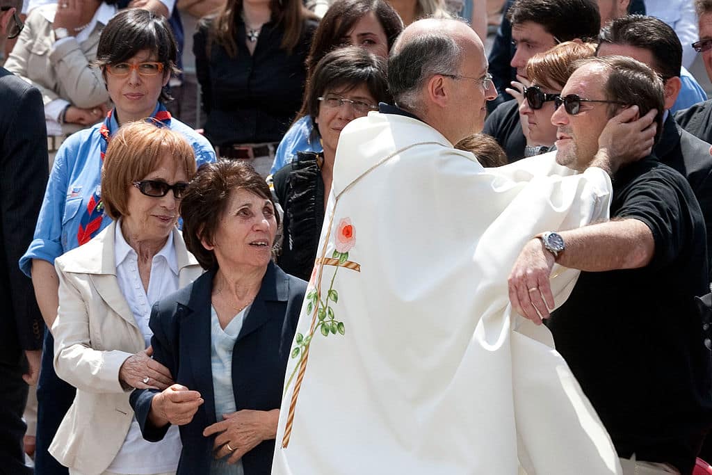 POTENZA, ITALY - JULY 02:  Filomena Iemma, Don Marcello Cozzi and Gildo Claps attend the Elisa Claps funeral on July 2, 2011 in Potenza, Italy.  The body of 16-year-old Claps was found hidden in the roof of Santa Trinita Church March 18, 2010 following her disappearance nearly 17 years earlier. Danilo Restivo, who was sentenced to life for the murder of Heather Barnett, now faces extradition for the alleged murder of Claps.  (Photo by GIOVANNI MARINO/Getty Images)