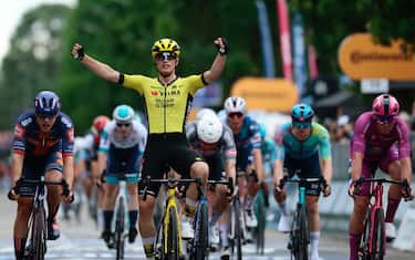 Team Visma-Lease a Bike's Dutch rider Olav Kooij celebrates after victory as he crosses the finish of the 12th stage of the 108th Giro d'Italia cycling race 172kms from Modena to Viadana on May 22, 2025. (Photo by Luca Bettini / AFP)