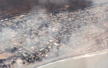 epa10792530 An arial view of buildings damaged in Lahaina, Hawaii as a result of a large wildfire which has killed 6 people and forced thousands of evacuations on the island of Maui in Hawaii, USA, 09 August 2023. Winds from Hurricane Dora, which is currently over the Pacific Ocean hundreds of miles south of Hawaii, have intensified the wildfires.  EPA/CARTER BARTO