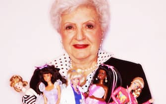 Ruth Handler, Mattel Inc. co-founder and Barbie Doll inventor poses with a selection of Barbie Dolls. (Photo by Vicky Kasala/Getty Images)