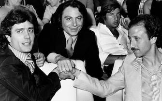 The Italian singer Giovanni Nazzaro (known as Gianni Nazzaro) is posing at the music festival Un disco per l'estate with the singers Peppino Gagliardi (in the center) and Umberto Balsamo (on the right); behind them the Italian singer Sandro Giacobbe, who is the author of the song Nazzaro is singing at the festival. Saint Vincent (AO), Italy, 1974.. (Photo by Angelo Deligio/Mondadori via Getty Images)