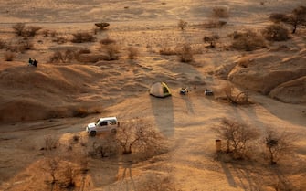 We can see sandy landscape from above.