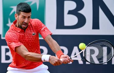 Novak Djokovic of Serbia in action during his men's singles third round match against Grigor Dimitrov of Bulgaria (not pictured) at the Italian Open tennis tournament in Rome, Italy, 14 May 2023.  ANSA/ETTORE FERRARI 