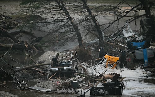A photo shows overturned vehicles and broken trees after flooding caused by a flash flood at the Guadalupe River in Kerrville, Texas, on July 5, 2025. Rescuers were desperately searching for at least 20 girls missing from a riverside summer camp, officials said on July 5, after torrential rains caused a "catastrophic" flash flood that killed at least 24 people as it swept through south-central Texas. (Photo by RONALDO SCHEMIDT / AFP) (Photo by RONALDO SCHEMIDT/AFP via Getty Images)          