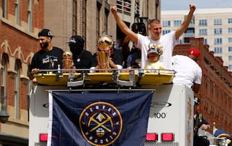 DENVER, COLORADO - JUNE 15: Jamal Murray #27 and Nikola Jokic #15 wave to fans during the Denver Nuggets victory parade and rally after winning the 2023 NBA Championship on June 15, 2023 in Denver, Colorado. NOTE TO USER: User expressly acknowledges and agrees that, by downloading and or using this photograph, User is consenting to the terms and conditions of the Getty Images License Agreement. (Photo by Justin Edmonds/Getty Images)