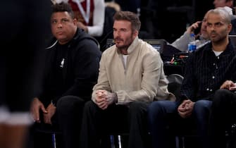 (from L) Former football players Ronaldo from Brazil and David Beckham form England and French former basketball player Tony Parker attend the NBA regular season basketball match between the Cleveland Cavaliers and the Brooklyn Nets at the Accor Arena in Paris on January 11, 2024. (Photo by EMMANUEL DUNAND / AFP)