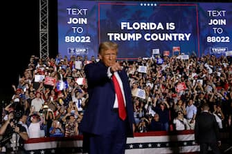 HIALEAH, FL - NOVEMBER 8: Former U.S. President Donald Trump stands on stage during a rally at The Ted Hendricks Stadium at Henry Milander Park on November 8, 2023 in Hialeah, Florida. Even as Trump faces multiple criminal indictments, he still maintains a commanding lead in the polls over other Republican candidates. (Photo by Alon Skuy/Getty Images)