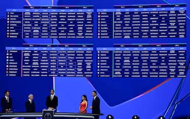 The results are displayed on a screen following the draw ceremony for the group stage of the 2025-2026 UEFA Champions League football tournament, at the Grimaldi Forum in Monaco on August 28, 2025. (Photo by Frederic DIDES / AFP)