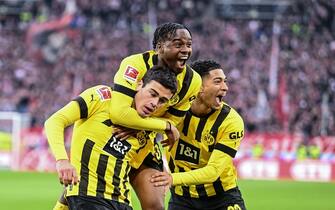 STUTTGART, GERMANY - APRIL 15: Giovanni Reyna of Borussia Dortmund celebrates after scoring his team's third goal with teammates during the Bundesliga match between VfB Stuttgart and Borussia Dortmund at Mercedes-Benz Arena on April 15, 2023 in Stuttgart, Germany. (Photo by Harry Langer/DeFodi Images via Getty Images)