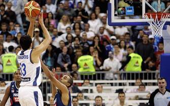 BELGRADE, SERBIA AND MONTENEGRO - SEPTEMBER 24: Dimitrios Diamantidis of Greece scores the winning points during the FIBA EuroBasket 2005 semi final match between France and Greece on September 24, 2005 in Belgrade, Serbia and Montenegro.  (Photo by Lars Baron/Bongarts/Getty Images)