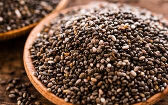 Chia seeds in wooden bowl