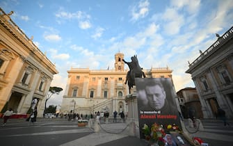 Portraits of Kremlin's most prominent critic Alexei Navalny and flowers are set in front of Rome's city hall prior a vigil following is death, on February 19, 2024. Russia reported Navalny's death in an arctic prison on February 16, 2024 and his mother has been denied access to the body, enraging supporters who have accused authorities of trying to cover up Navalny's "murder". (Photo by Filippo MONTEFORTE / AFP) (Photo by FILIPPO MONTEFORTE/AFP via Getty Images)