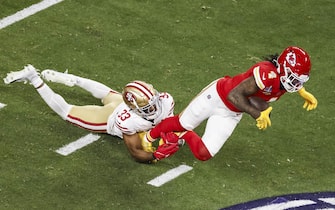 epa11146445 San Fransisco 49ers' saftey Logan Ryan (L) brings down the Kansas City Chiefs wide receiver Rashee Rice (R) during the first half of Super Bowl LVIII between the Kansas City Chiefs and the San Fransisco 49ers at Allegiant Stadium in Las Vegas, Nevada, USA, 11 February 2024. The Super Bowl is the annual championship game of the NFL between the AFC Champion and the NFC Champion and has been held every year since 1967.  EPA/CAROLINE BREHMAN
