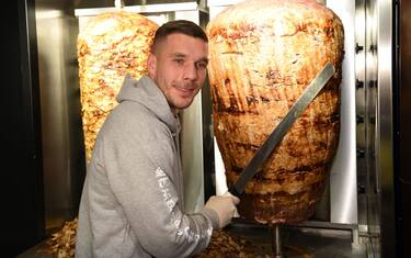 German soccer star Lukas Podolski attends the opening of a doner shop in Cologne, Germany, 6 January 2018. Podolski is a co-partner of the 'Mangal Doener' business. Photo: Henning Kaiser/dpa (Photo by Henning Kaiser/picture alliance via Getty Images)
