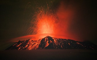 TOPSHOT - Incandescent materials, ash and smoke are spewed from the Popocatepetl volcano in San Nicolas de los Ranchos, Puebla state, Mexico on May 20, 2023. (Photo by Osvaldo Cantero / AFP) (Photo by OSVALDO CANTERO/AFP via Getty Images)