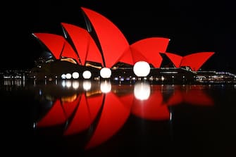 SYDNEY, AUSTRALIA - January 23: The Sydney Opera House is illuminated red as part of Lunar New Year celebrations in Sydney, Australia, on Monday, January 23, 2023. Sydney's official Chinese New Year festival is said to be the largest Lunar New Year celebration outside of Asia. (Photo by Steven Saphore/Anadolu Agency via Getty Images)