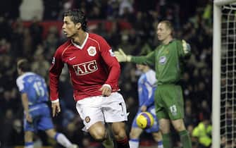 MANCHESTER, ENGLAND - DECEMBER 26: Cristiano Ronaldo of Manchester United celebrates scoring the first goal during the Barclays Premiership match between Manchester United and Wigan Athletic at Old Trafford on December 26 2006 in Manchester, England. (Photo by Tom Purslow/Manchester United via Getty Images)