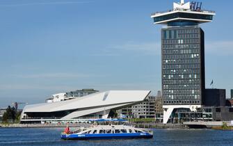 Waterfront of Amsterdam Noord district with modern building of EYE Film Institute and Amsterdam Tower The Netherlands, (North bank of the IJ)